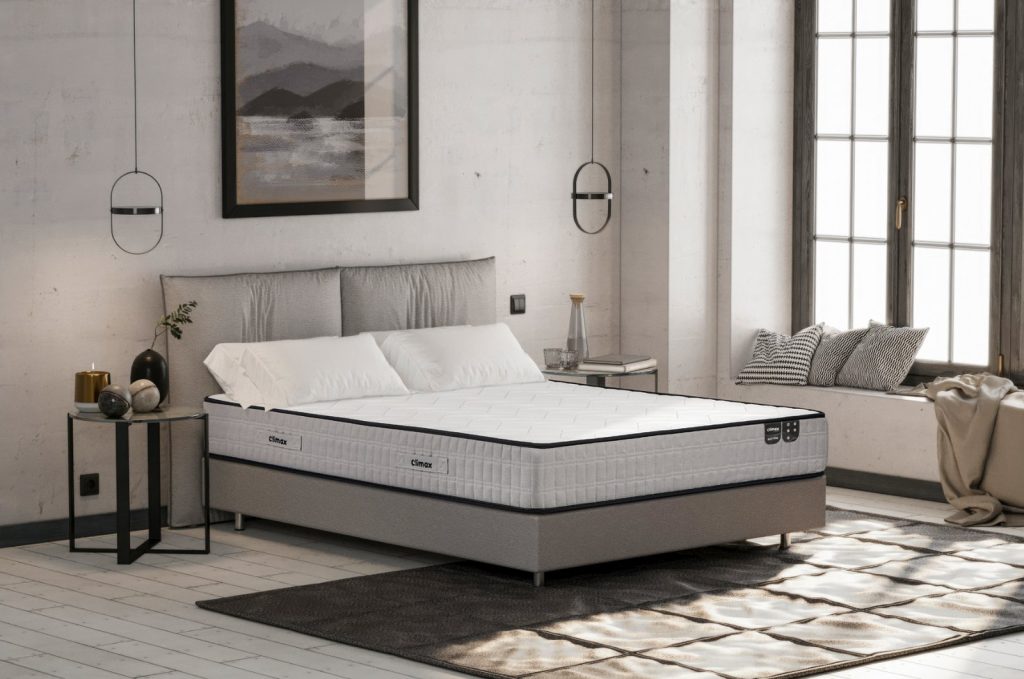 Colchão Climax Max Firm num quarto de estilo industrial