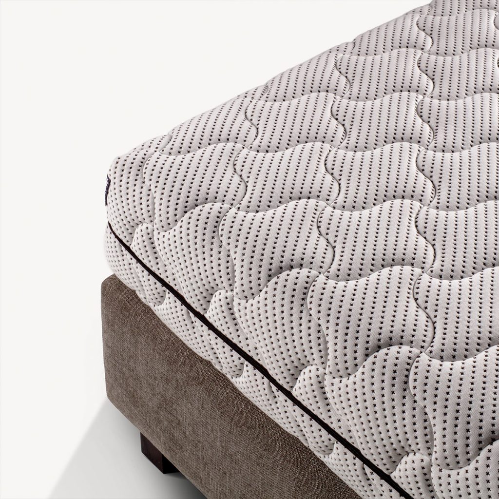 Colchão Colunex Eco Plus, canto com a capa de malha e o debrum castanho